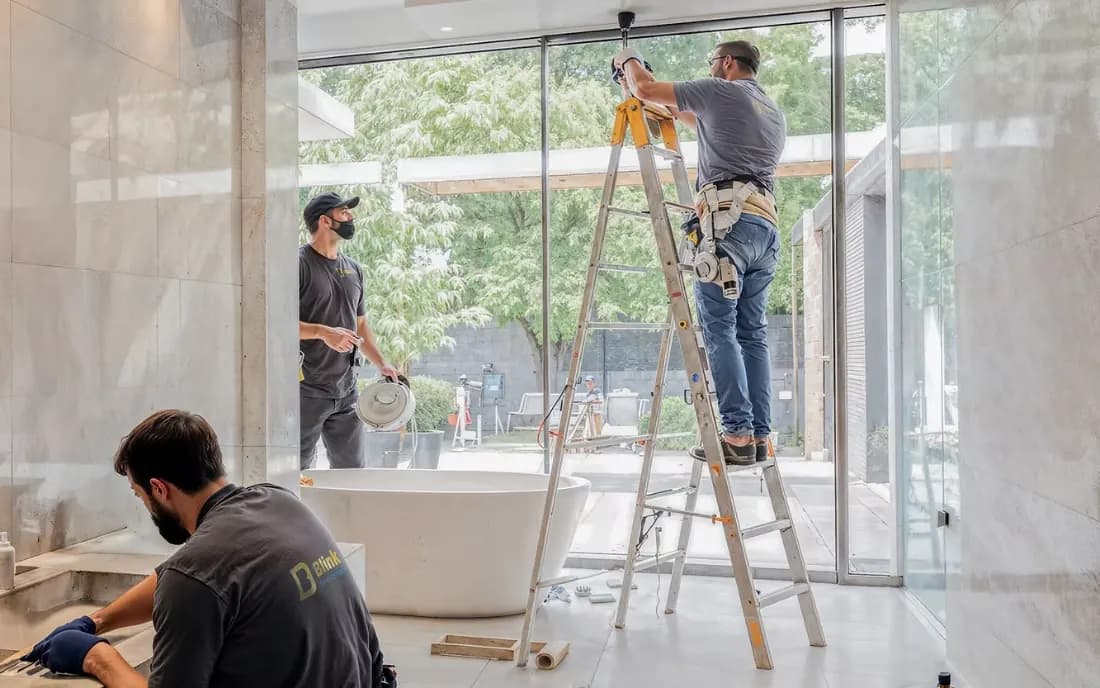 Our team installing fixtures during a bathroom renovation